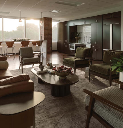 Modern office breakroom and employee lounge featuring custom millwork, collaborative seating areas, hospitality-inspired workplace design, and biophilic elements designed to enhance employee experience and workplace culture.